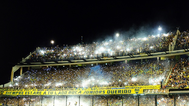 Supporters of Boca Juniors cheer for their team before their Copa Sudamericana semifinal football match against River Plate at La Bombonera stadium in Buenos Aires, Argentina, on November 20, 2014. AFP PHOTO / Maxi Failla